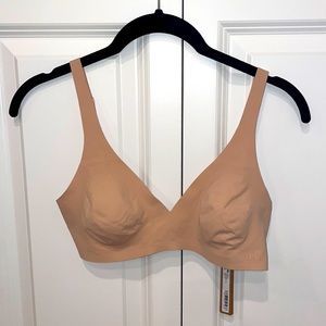 Skims Naked Plunge Bra in color mica.